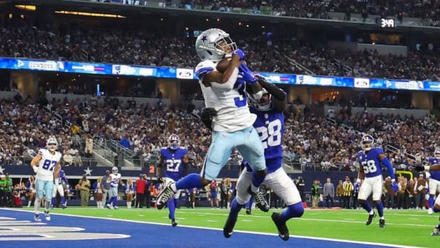 Brandin Cooks (3) scores one of Dallas' seven touchdowns on Sunday afternoon